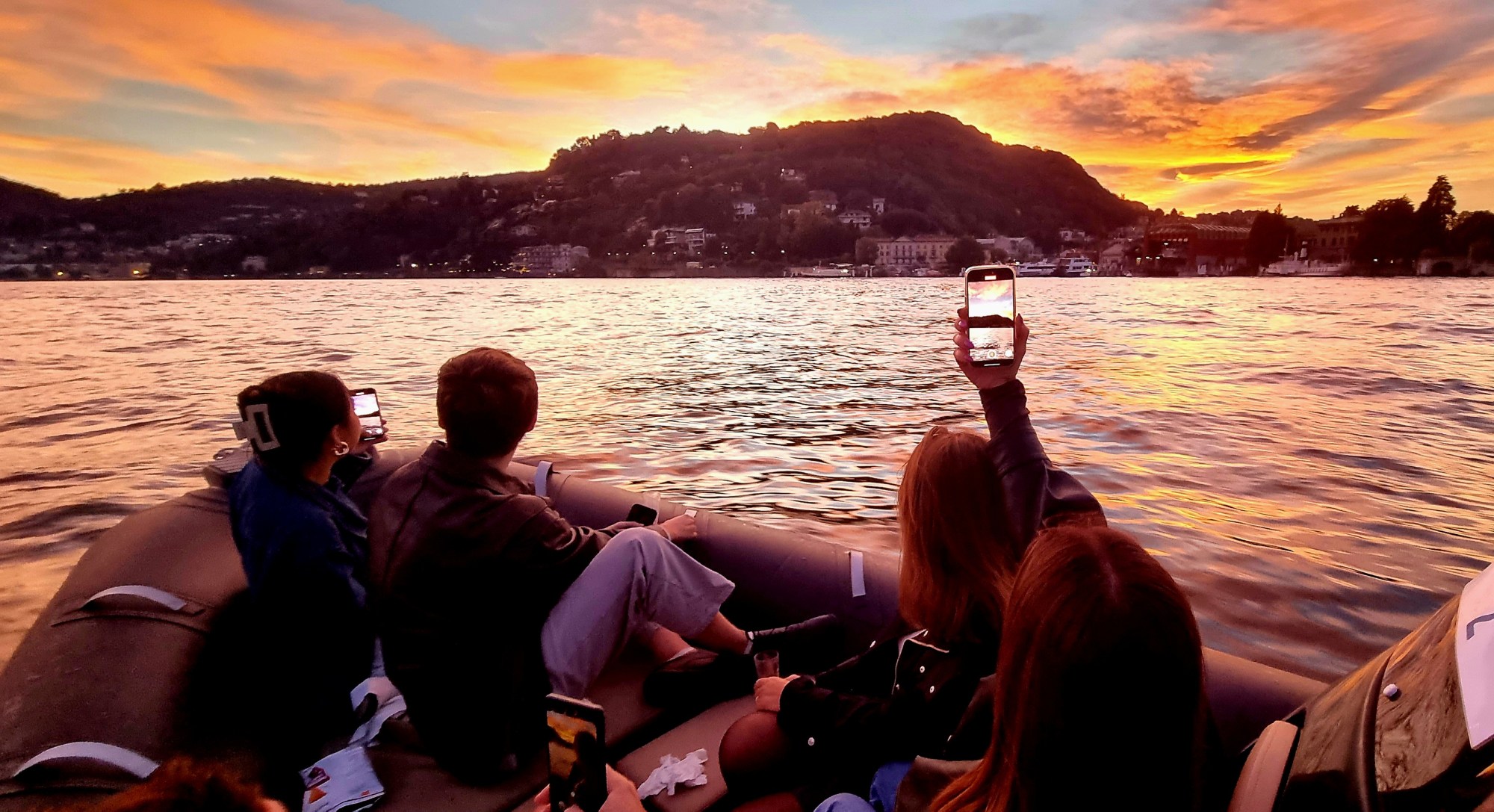 Lake Como sunset boat tour with golden reflections on the water