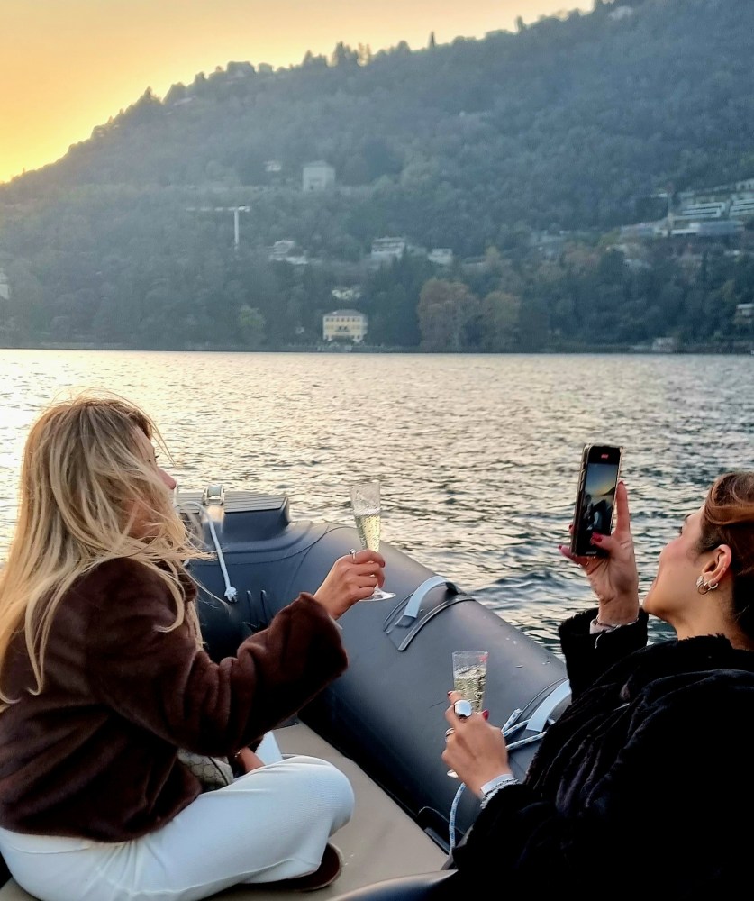 Prosecco toast during Lake Como sunset cruise
