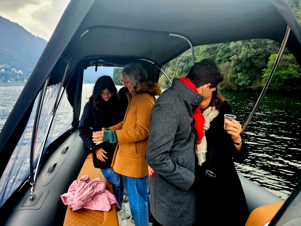 Romantic couple enjoying a Lake Como boat tour